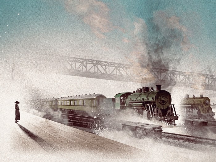 A woman stands on a platform at the train station.